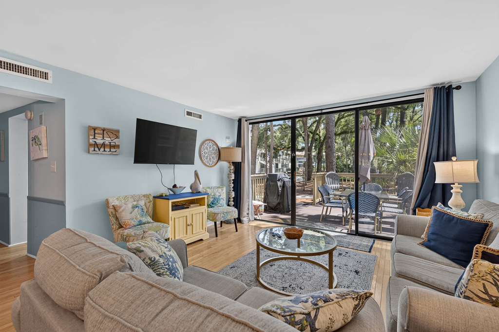 Beach access condo with deck, pool, washer dryer, and AC - snowbird-friendly