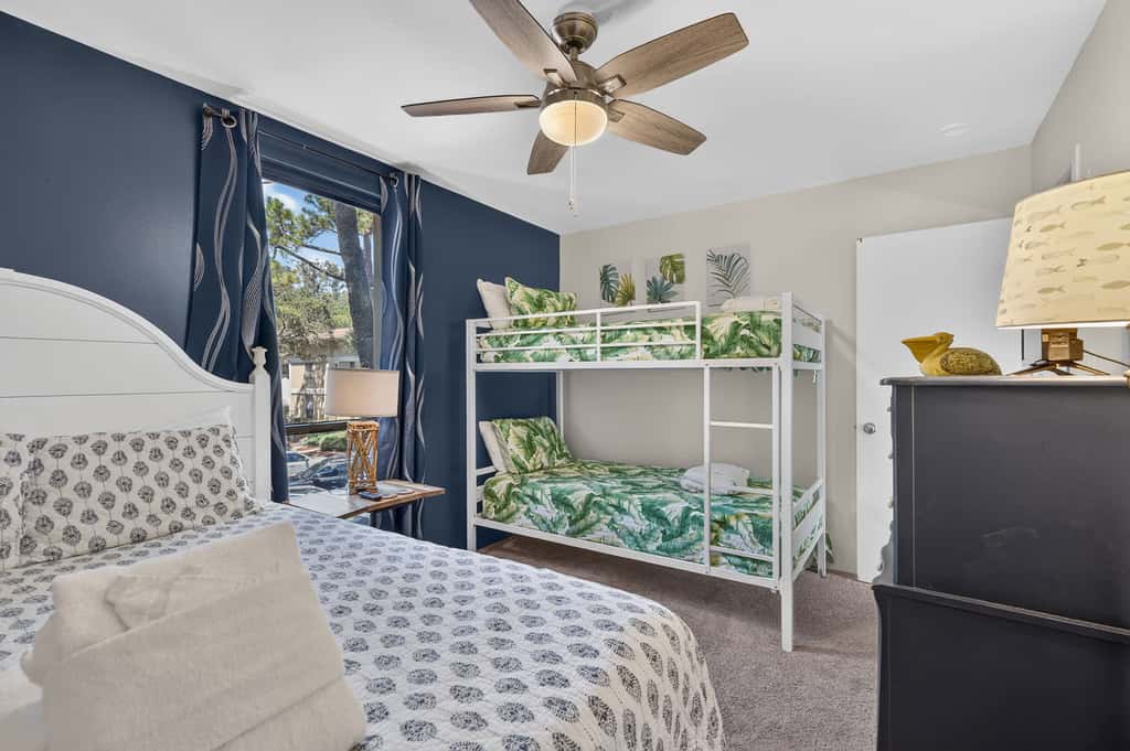 Beach access condo with deck, pool, washer dryer, and AC - snowbird-friendly