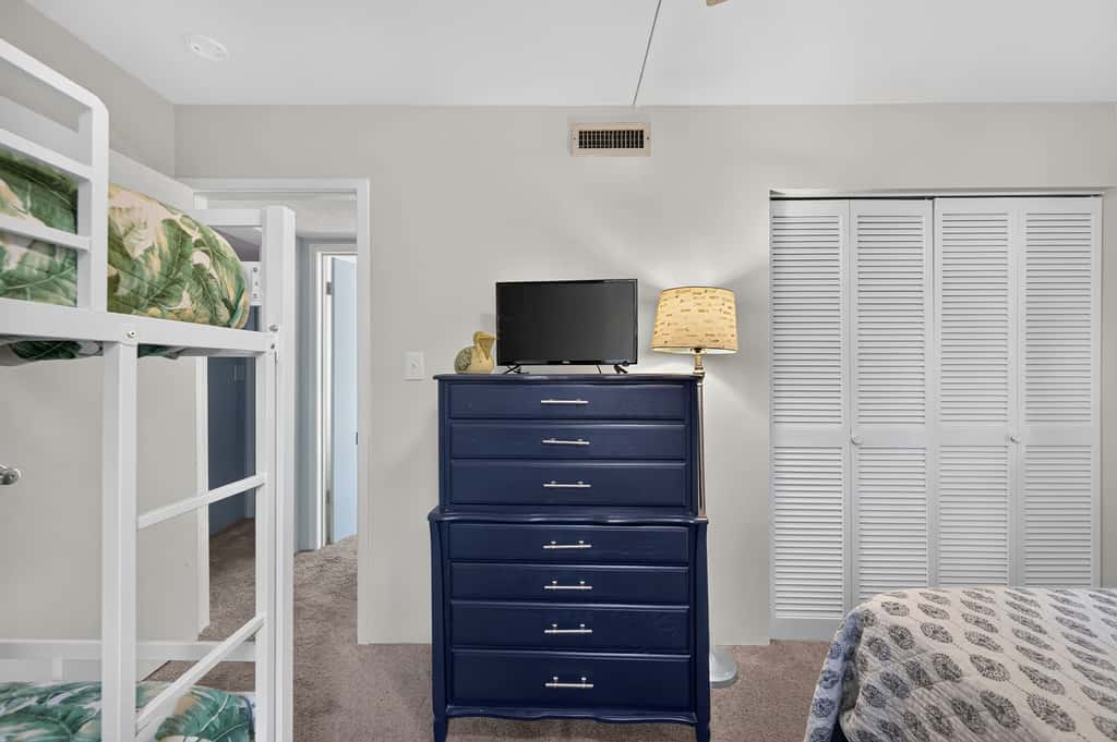 Beach access condo with deck, pool, washer dryer, and AC - snowbird-friendly