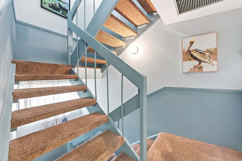 Beach access condo with deck, pool, washer dryer, and AC - snowbird-friendly