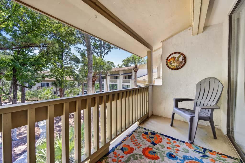 Beach access condo with deck, pool, washer dryer, and AC - snowbird-friendly