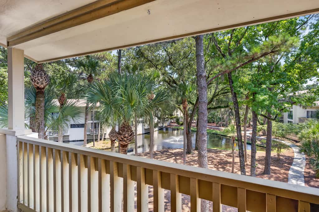 Beach access condo with deck, pool, washer dryer, and AC - snowbird-friendly
