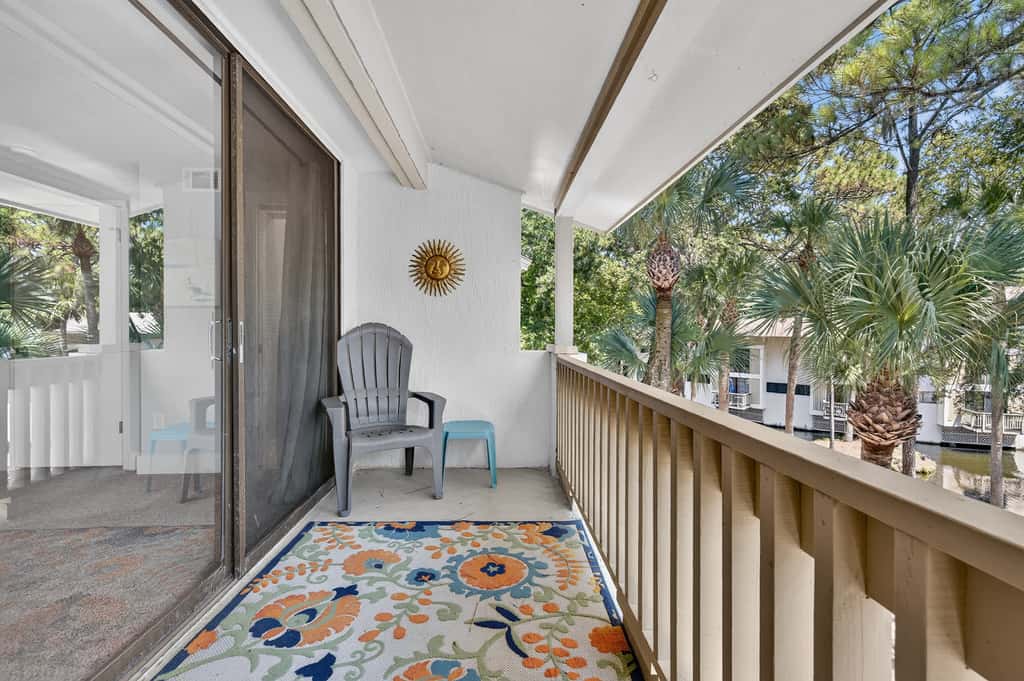 Beach access condo with deck, pool, washer dryer, and AC - snowbird-friendly