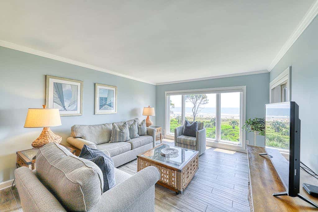 Updated beach gem with ocean views, pool, hot tub, & tennis - snowbird-friendly