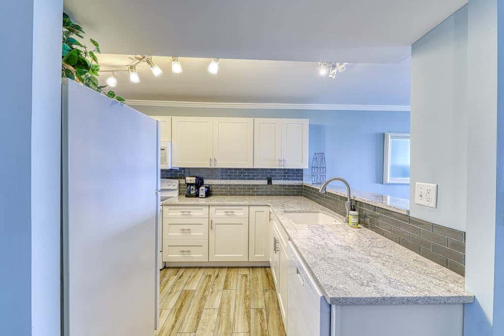 Updated beach gem with ocean views, pool, hot tub, & tennis - snowbird-friendly