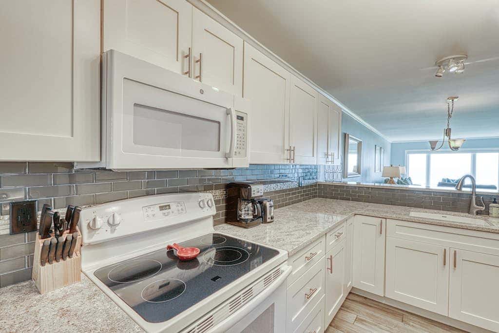 Updated beach gem with ocean views, pool, hot tub, & tennis - snowbird-friendly