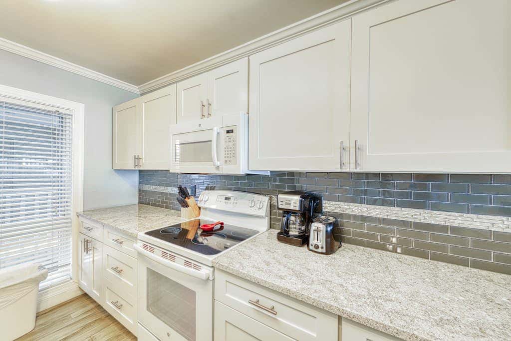 Updated beach gem with ocean views, pool, hot tub, & tennis - snowbird-friendly