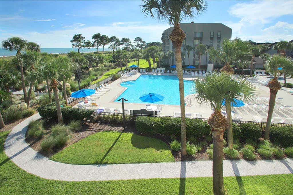 Updated beach gem with ocean views, pool, hot tub, & tennis - snowbird-friendly