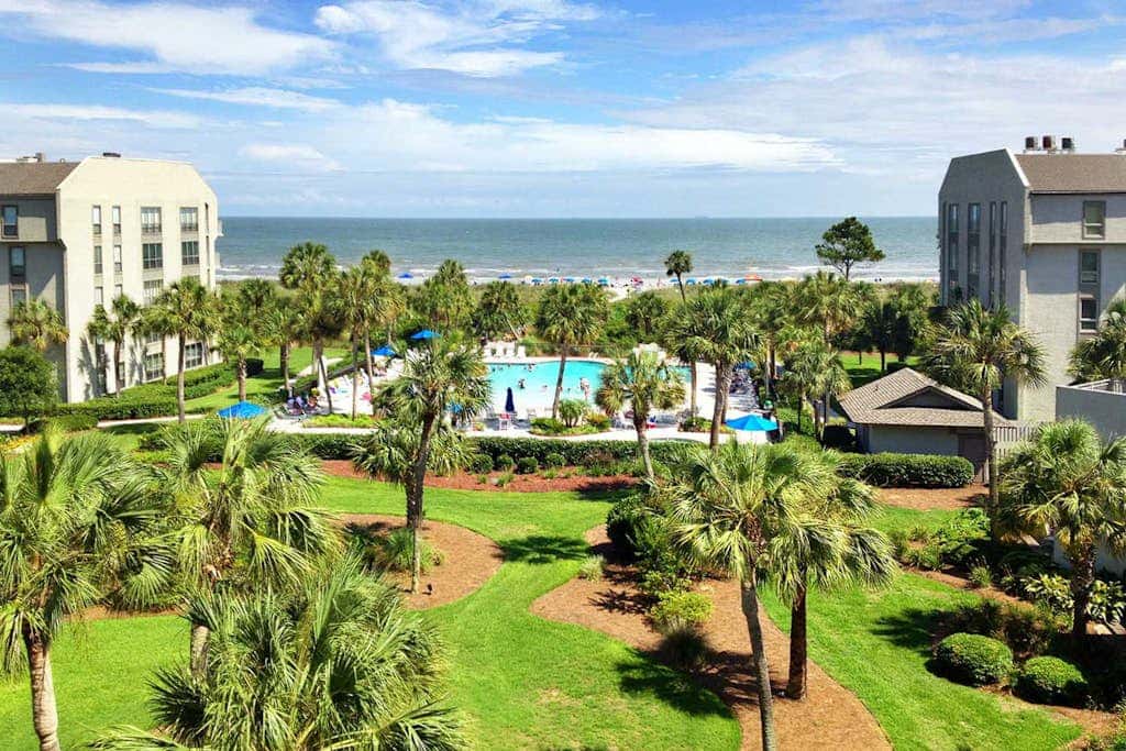 Updated beach gem with ocean views, pool, hot tub, & tennis - snowbird-friendly