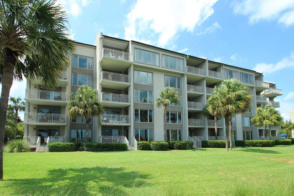 Updated beach gem with ocean views, pool, hot tub, & tennis - snowbird-friendly