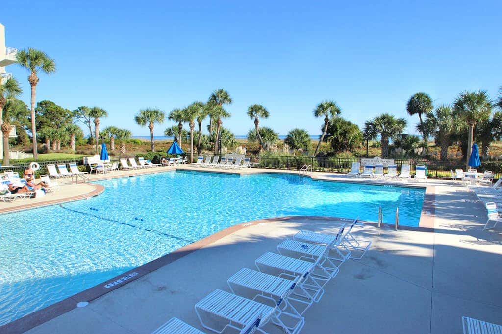 Updated beach gem with ocean views, pool, hot tub, & tennis - snowbird-friendly