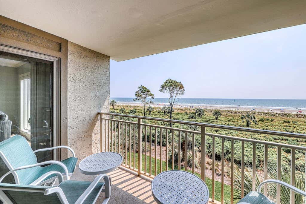 Updated beach gem with ocean views, pool, hot tub, & tennis - snowbird-friendly