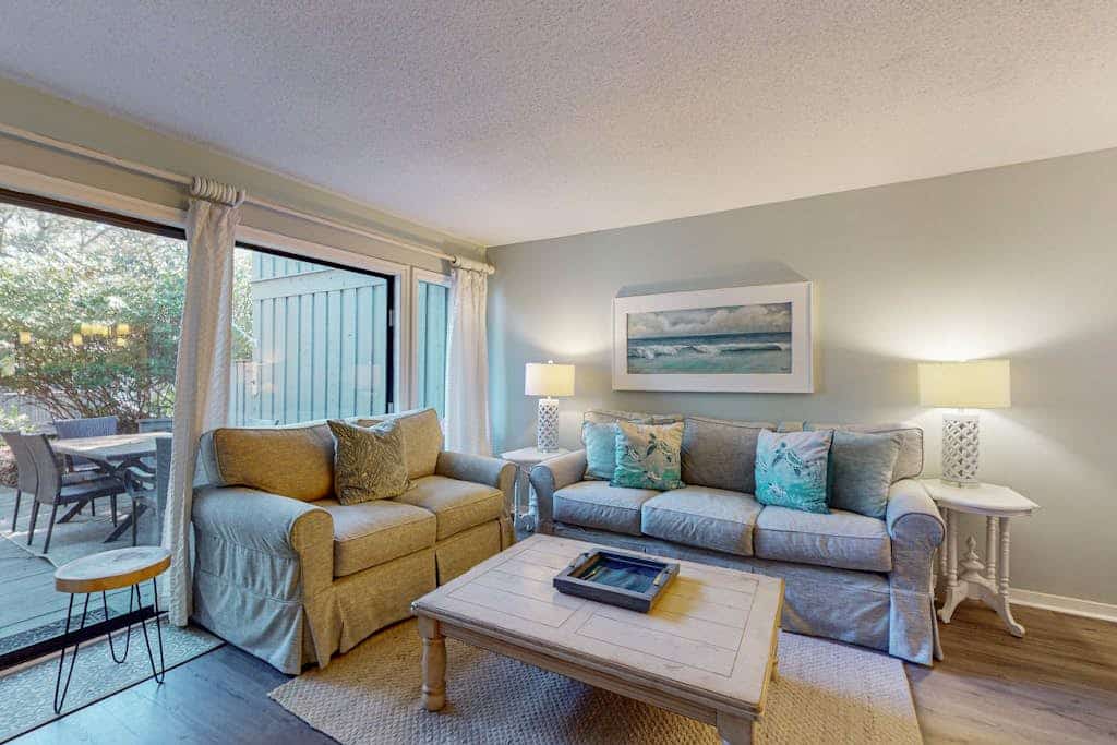 Comfortable two-story Villa with beach access, shared pool, private deck, and washer dryer