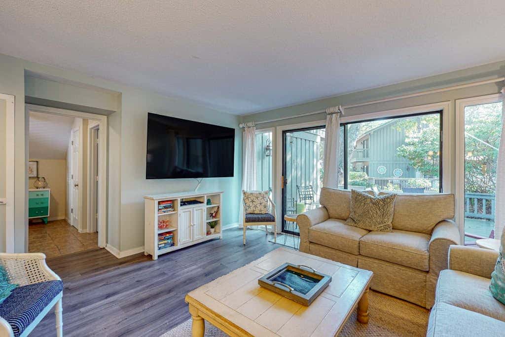 Comfortable two-story Villa with beach access, shared pool, private deck, and washer dryer