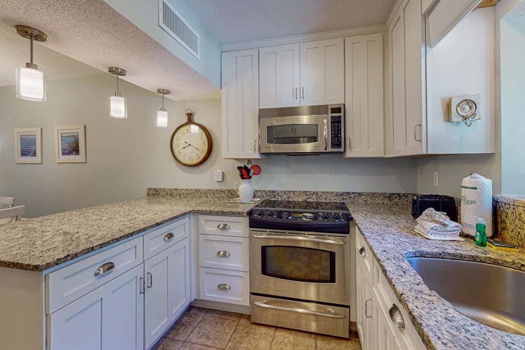 Comfortable two-story Villa with beach access, shared pool, private deck, and washer dryer