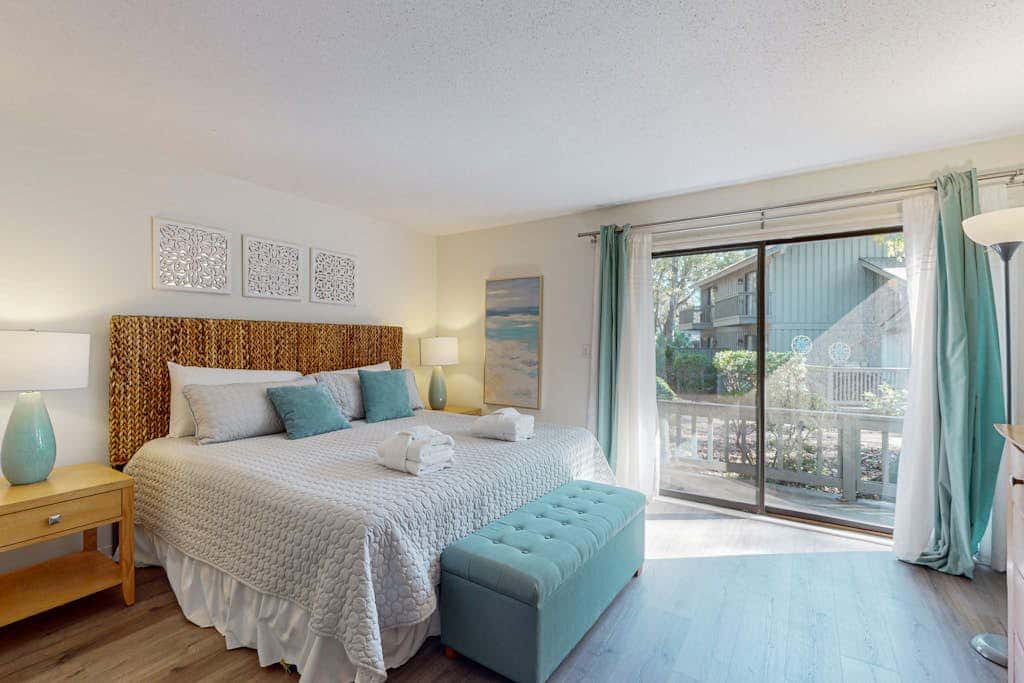 Comfortable two-story Villa with beach access, shared pool, private deck, and washer dryer