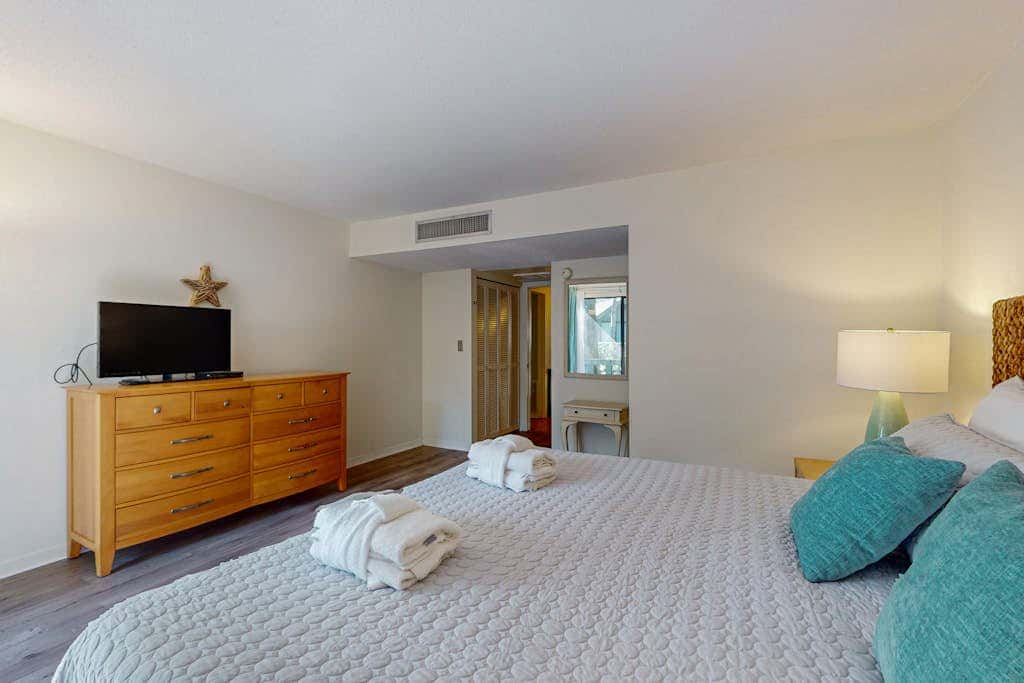 Comfortable two-story Villa with beach access, shared pool, private deck, and washer dryer