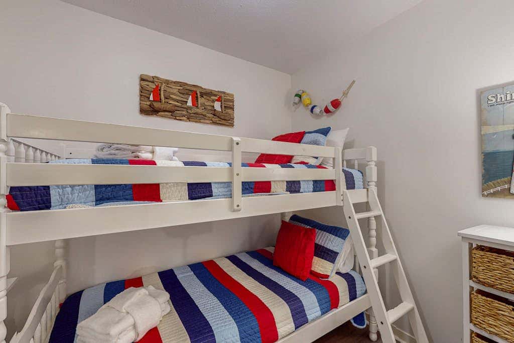 Comfortable two-story Villa with beach access, shared pool, private deck, and washer dryer