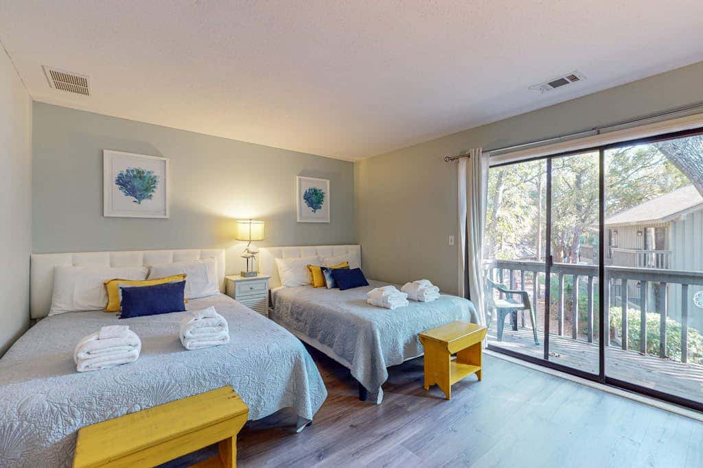 Comfortable two-story Villa with beach access, shared pool, private deck, and washer dryer