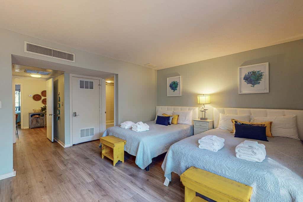 Comfortable two-story Villa with beach access, shared pool, private deck, and washer dryer