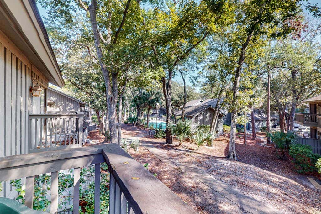 Comfortable two-story Villa with beach access, shared pool, private deck, and washer dryer
