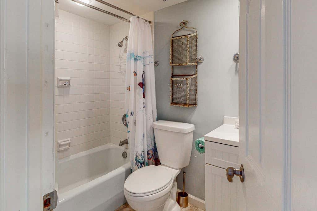 Comfortable two-story Villa with beach access, shared pool, private deck, and washer dryer