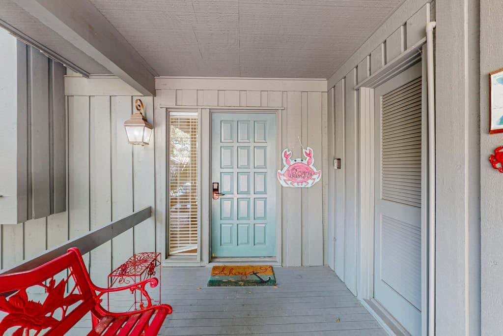 Comfortable two-story Villa with beach access, shared pool, private deck, and washer dryer