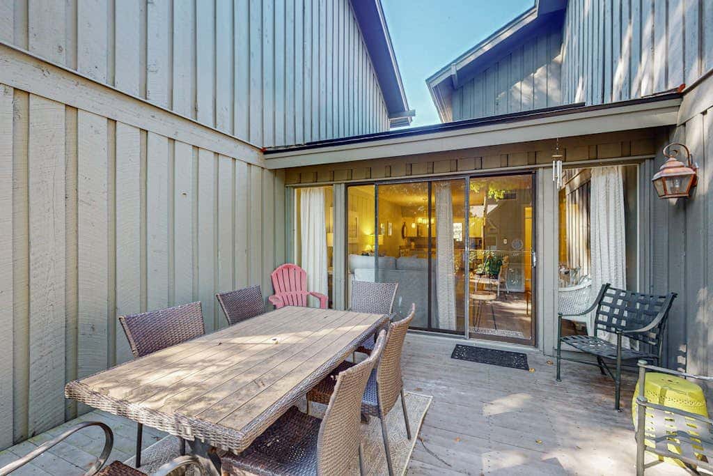 Comfortable two-story Villa with beach access, shared pool, private deck, and washer dryer