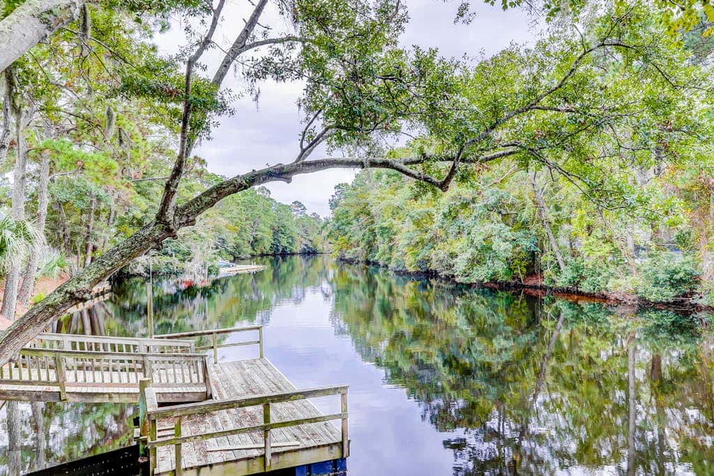 Comfortable two-story Villa with beach access, shared pool, private deck, and washer dryer