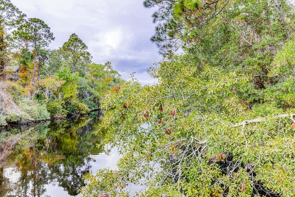 Comfortable two-story Villa with beach access, shared pool, private deck, and washer dryer