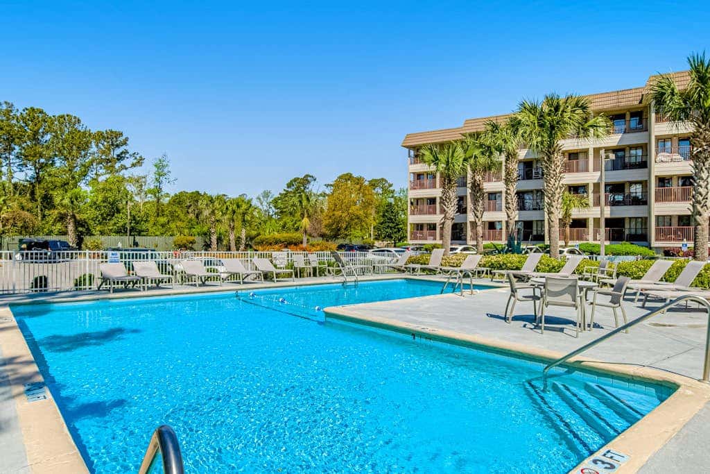 1st floor condo near the beach with pool, tennis, balcony, gym, streaming, WD