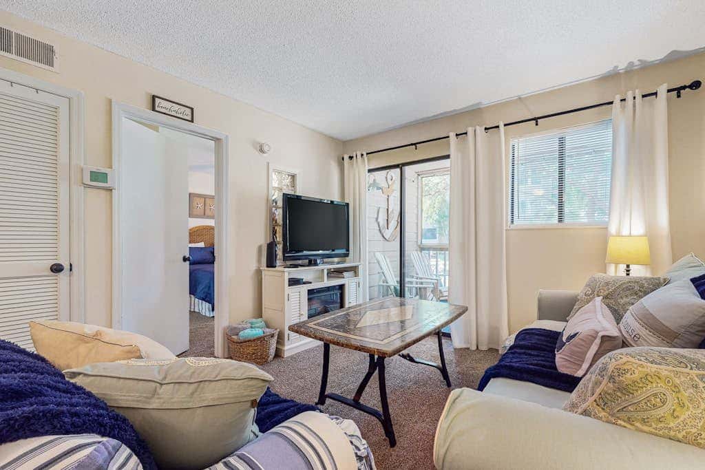 Villa by the beach with heated pools, hot tub, patio, tennis, central AC, & WD