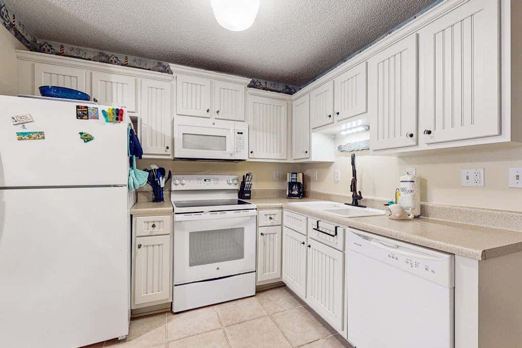 Villa by the beach with heated pools, hot tub, patio, tennis, central AC, & WD
