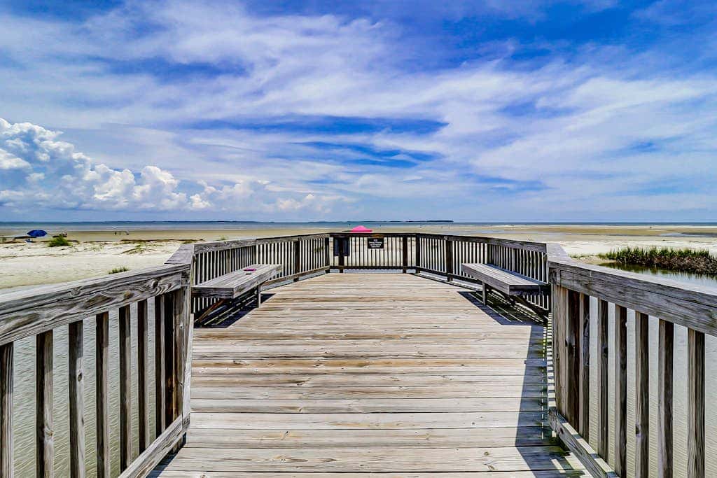 Villa by the beach with heated pools, hot tub, patio, tennis, central AC, & WD