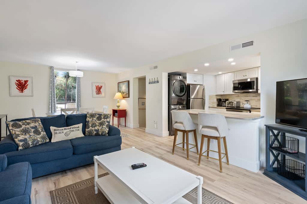 Coastal condo with private grill and shared pool, nearby beach access 