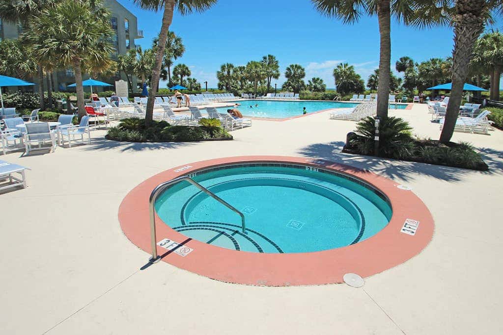 First Floor Condo near the beach with beach gear, washer and dryer, and pool