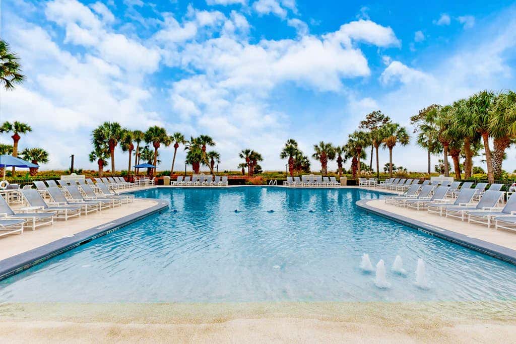 First Floor Condo near the beach with beach gear, washer and dryer, and pool