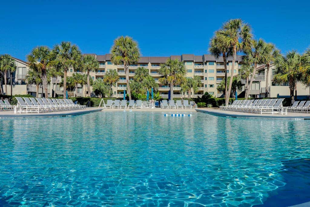 First Floor Condo near the beach with beach gear, washer and dryer, and pool