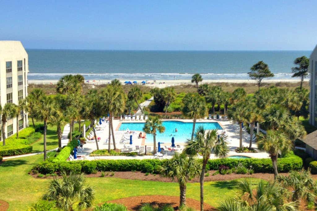 First Floor Condo near the beach with beach gear, washer and dryer, and pool