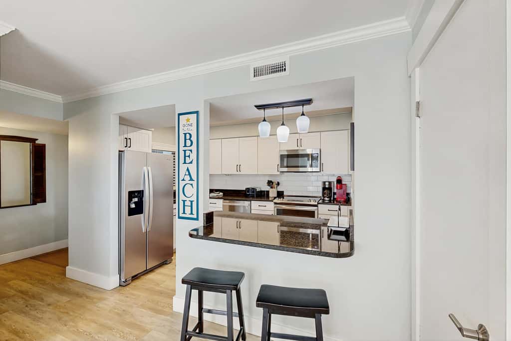 First Floor Condo near the beach with beach gear, washer and dryer, and pool