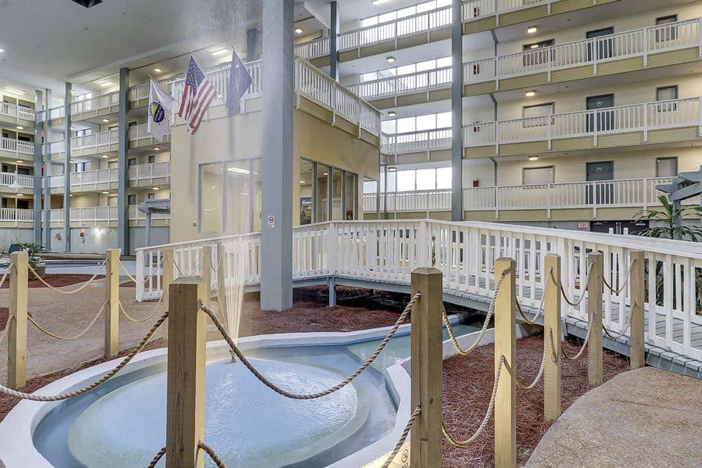 Beach condo with balcony, pools, & hot tub- near golf & beach