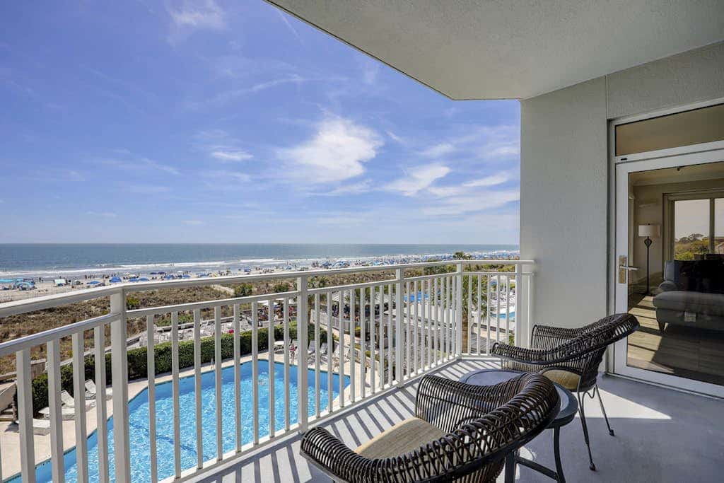Panoramic direct oceanfront view condo with pool, hot tub, gym & steps to beach