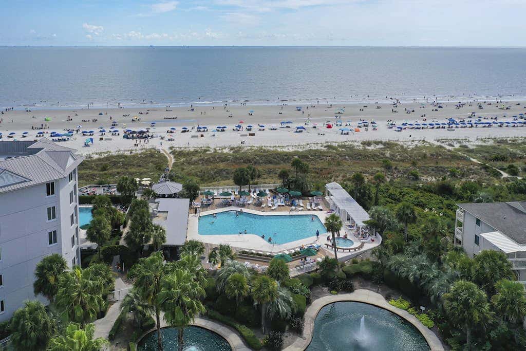 Panoramic direct oceanfront view condo with pool, hot tub, gym & steps to beach