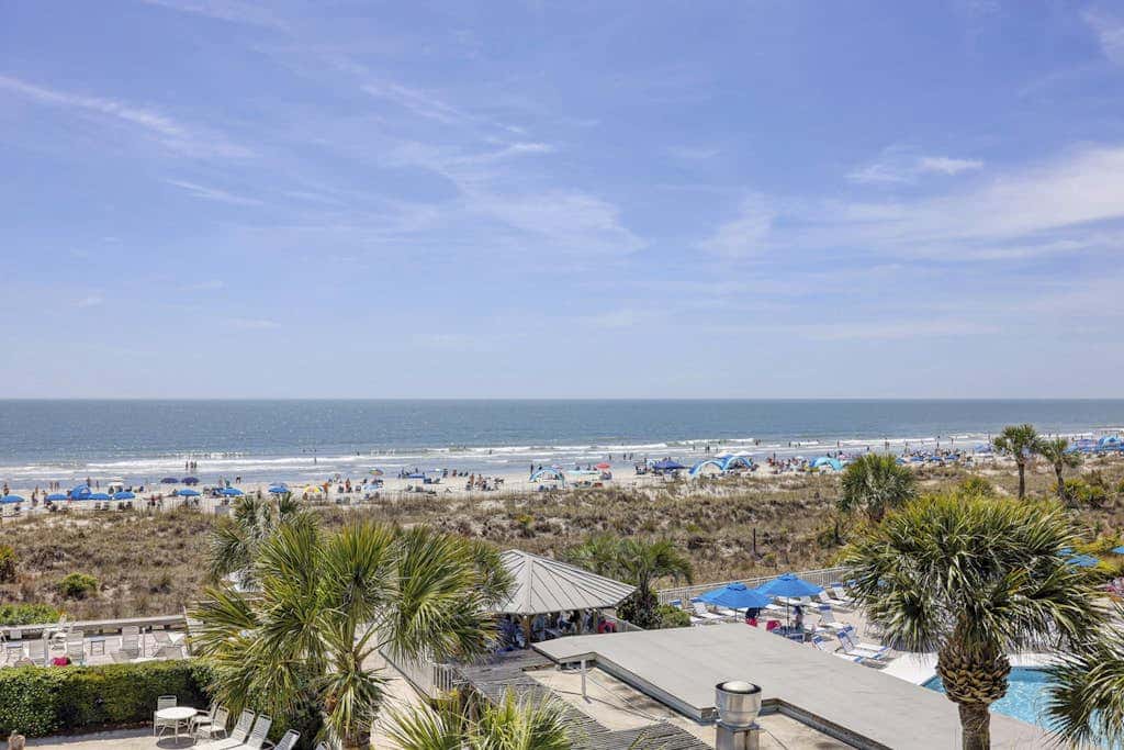 Panoramic direct oceanfront view condo with pool, hot tub, gym & steps to beach
