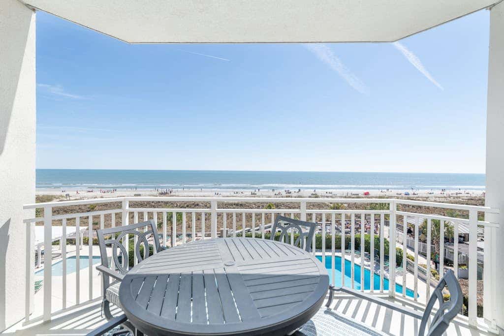Panoramic direct oceanfront view condo with pool, hot tub, gym & steps to beach