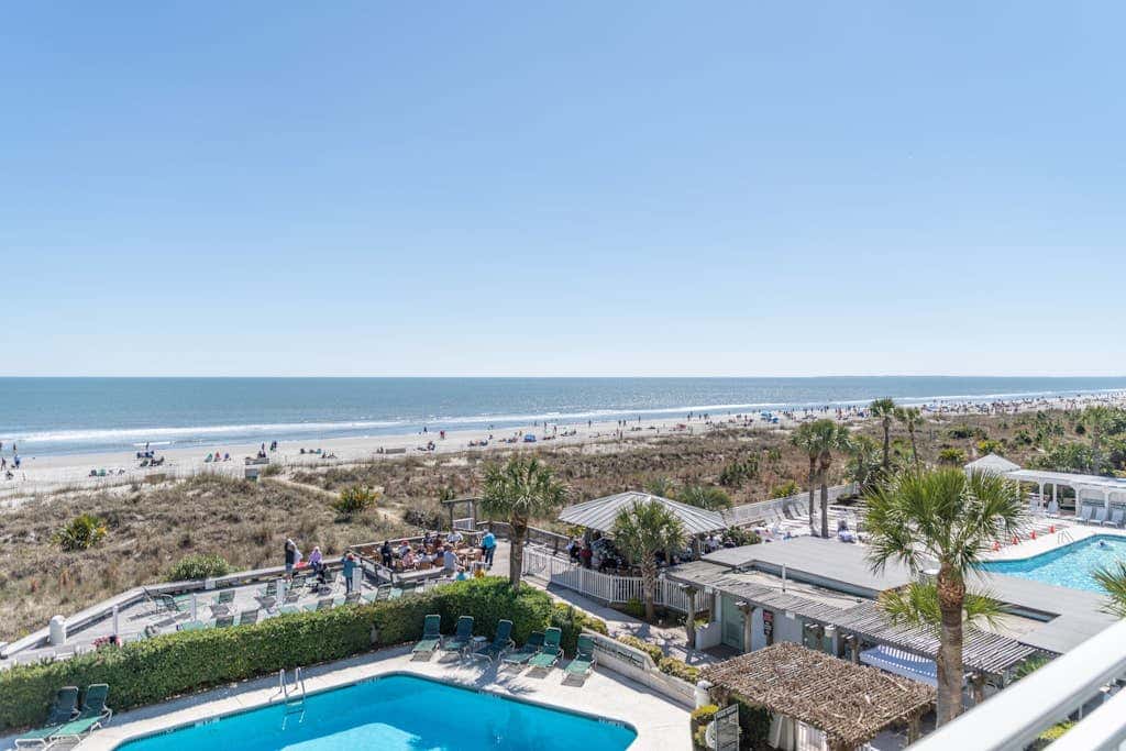Panoramic direct oceanfront view condo with pool, hot tub, gym & steps to beach