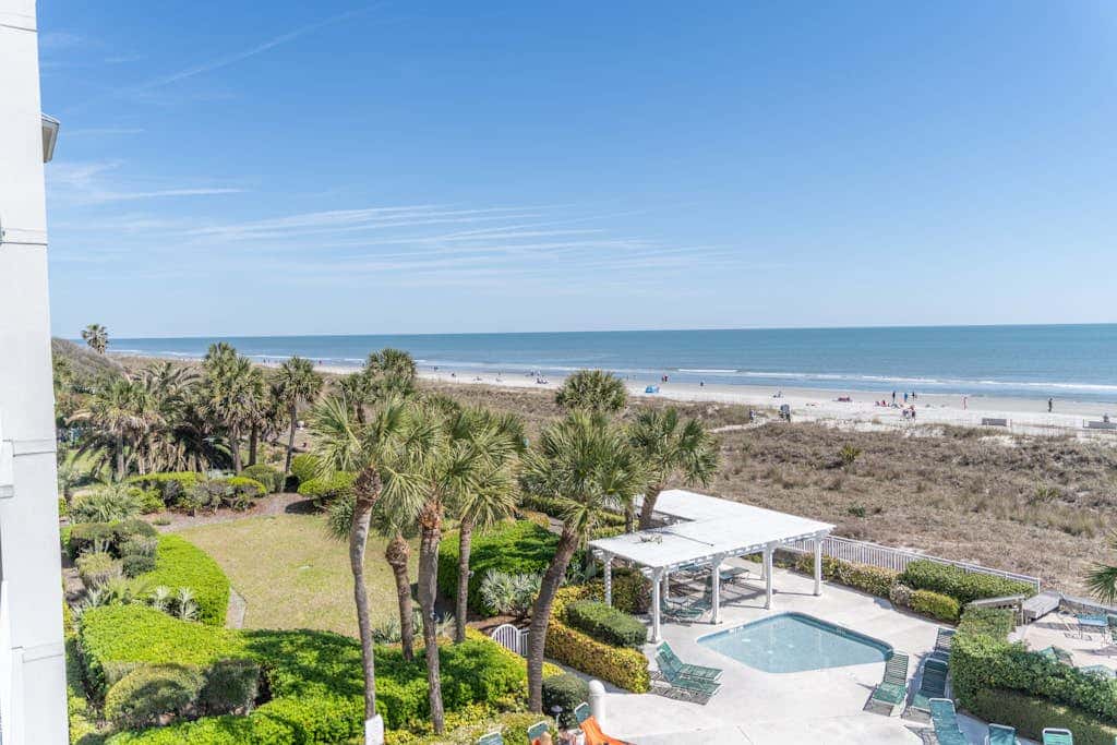 Panoramic direct oceanfront view condo with pool, hot tub, gym & steps to beach