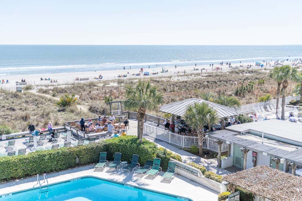 Panoramic direct oceanfront view condo with pool, hot tub, gym & steps to beach