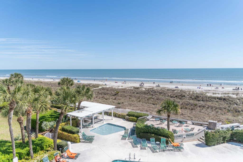 Panoramic direct oceanfront view condo with pool, hot tub, gym & steps to beach