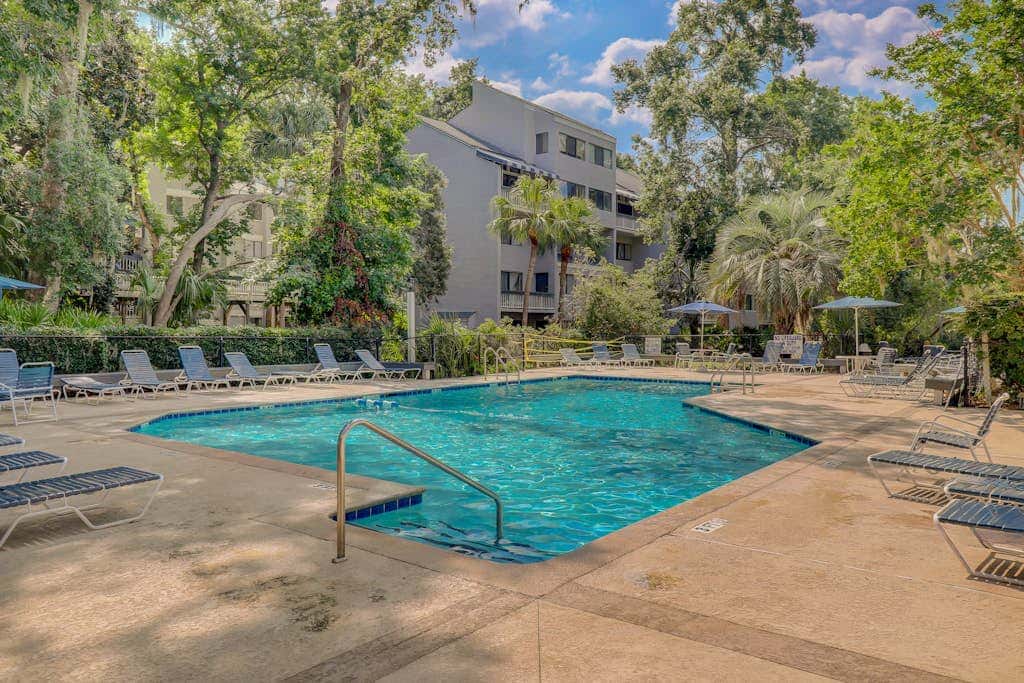 Coastal condo with outdoor pool, walk to beach and shopping